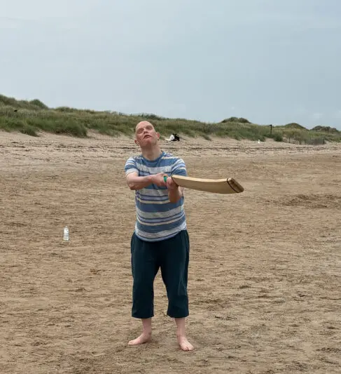 Playing beach cricket